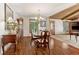 Well-lit dining room features wood floors, a classic grandfather clock and buffet at 1981 Luke Edwards Rd, Dacula, GA 30019
