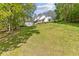 A charming white house with a welcoming porch on a large lot at 1981 Luke Edwards Rd, Dacula, GA 30019