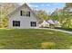 Picture of a white home with black shutters and a large grassy front lawn at 1981 Luke Edwards Rd, Dacula, GA 30019