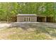 Exterior of the building with an attached covered space for storage or equipment at 1981 Luke Edwards Rd, Dacula, GA 30019