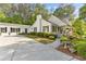 Charming white home with black shutters, manicured landscaping, and a welcoming driveway at 1981 Luke Edwards Rd, Dacula, GA 30019