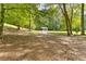 Exterior view of a building nestled in a lush, green forested area at 1981 Luke Edwards Rd, Dacula, GA 30019