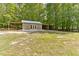 Exterior of the building with an attached covered space for storage or equipment at 1981 Luke Edwards Rd, Dacula, GA 30019