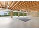 Spacious three-car garage with exposed rafters allows easy parking and storage space at 1981 Luke Edwards Rd, Dacula, GA 30019