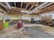Spacious garage interior featuring a workbench and ample storage space at 1981 Luke Edwards Rd, Dacula, GA 30019