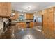 Charming kitchen with wood cabinetry, stone counters, and stainless steel appliances at 1981 Luke Edwards Rd, Dacula, GA 30019