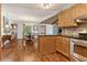 Open design showcases kitchen and dining areas with hardwood floors at 1981 Luke Edwards Rd, Dacula, GA 30019