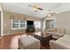 Inviting living room with a cozy fireplace, neutral colored furnishings, and large windows at 1981 Luke Edwards Rd, Dacula, GA 30019