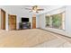 Large main bedroom features a ceiling fan, a fireplace, and a bay window at 1981 Luke Edwards Rd, Dacula, GA 30019