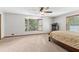 Spacious main bedroom features neutral carpet, bay window and lots of natural light at 1981 Luke Edwards Rd, Dacula, GA 30019