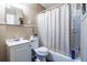 Standard bathroom with a white vanity, commode and tiled tub with shower at 120 Turman Se Ave, Atlanta, GA 30315
