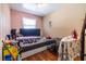 Bedroom with hardwood floors and natural light from a side window at 120 Turman Se Ave, Atlanta, GA 30315
