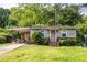 Charming single-story home with a covered carport and small front lawn at 120 Turman Se Ave, Atlanta, GA 30315
