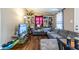 Relaxing living room with a large gray sectional sofa and hardwood floors at 120 Turman Se Ave, Atlanta, GA 30315