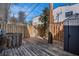Outdoor backyard with a wooden deck, privacy fence, and a shed offering a secluded space at 136 Peachtree Memorial Nw Dr # Va2, Atlanta, GA 30309