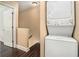 Convenient laundry area featuring a stacked washer and dryer and adjacent storage space at 136 Peachtree Memorial Nw Dr # Va2, Atlanta, GA 30309