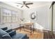 Bright office space with hardwood floors, a large window, and a modern desk setup at 136 Peachtree Memorial Nw Dr # Va2, Atlanta, GA 30309