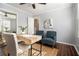 Cozy office featuring a modern desk, seating, and a mirror closet offering practical workspace at 136 Peachtree Memorial Nw Dr # Va2, Atlanta, GA 30309