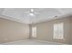 Cozy bedroom with white shutters on the windows, light-colored walls, and plush carpeting at 226 Hames Rd # 335, Woodstock, GA 30188