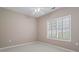 Bedroom with neutral walls and carpet, a ceiling fan, and plantation shutters on the window at 226 Hames Rd # 335, Woodstock, GA 30188