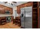 Modern kitchen with stainless steel appliances, hardwood floors, and cherry cabinets with under-cabinet lighting at 226 Hames Rd # 335, Woodstock, GA 30188