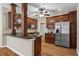 Updated kitchen with granite countertops, stainless steel appliances, and hardwood floors and cherry cabinets at 226 Hames Rd # 335, Woodstock, GA 30188