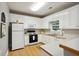 Eat-in kitchen with white cabinets, updated appliances, and countertops at 226 Hames Rd # 335, Woodstock, GA 30188