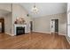 Bright living room with hardwood floors, a fireplace, and high ceilings with lots of natural light at 226 Hames Rd # 335, Woodstock, GA 30188
