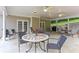 Covered patio space perfect for outdoor entertaining with neutral decor, ceiling fans, and elegant furniture at 226 Hames Rd # 335, Woodstock, GA 30188