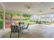Spacious covered patio featuring an outdoor sitting area with a landscaped backyard at 226 Hames Rd # 335, Woodstock, GA 30188