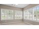Bright sunroom with tile flooring and large windows with plantation shutters allowing for great natural light at 226 Hames Rd # 335, Woodstock, GA 30188