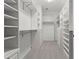 A well-organized walk-in closet with custom shelving, drawers, and ample hanging space at 226 Hames Rd # 335, Woodstock, GA 30188