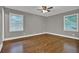 Bright bedroom with hardwood floors and natural light from the windows with views at 2417 Jade Dr, Lawrenceville, GA 30044