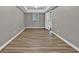 Bedroom featuring new laminate floors and fresh grey paint at 2417 Jade Dr, Lawrenceville, GA 30044