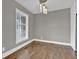 Cozy dining area with hardwood floors, natural light, and modern chandelier at 2417 Jade Dr, Lawrenceville, GA 30044