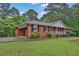 Brick home featuring an attached carport and lush green lawn at 2417 Jade Dr, Lawrenceville, GA 30044