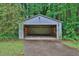 Spacious detached garage with ample storage space, perfect for a workshop or parking at 2417 Jade Dr, Lawrenceville, GA 30044