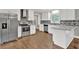 Renovated kitchen with stainless steel appliances, white cabinets, and granite countertops at 2417 Jade Dr, Lawrenceville, GA 30044