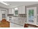 Modern kitchen with stainless steel appliances and granite countertops at 2417 Jade Dr, Lawrenceville, GA 30044