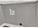 A laundry area showing hook ups for washer and dryer with base trim at 2417 Jade Dr, Lawrenceville, GA 30044