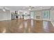 Open concept living space featuring hardwood floors, modern kitchen, brick fireplace, and natural light at 2417 Jade Dr, Lawrenceville, GA 30044