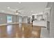 Spacious open-concept living room with a fireplace, hardwood floors, and a modern kitchen at 2417 Jade Dr, Lawrenceville, GA 30044