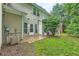 Backyard featuring a small patio, grassy area, and the home's rear exterior at 3733 Sidney Lanier Blvd, Duluth, GA 30096