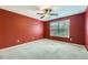 Bedroom with red walls, a ceiling fan, and a window with natural light at 3733 Sidney Lanier Blvd, Duluth, GA 30096