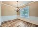Well-lit dining room features hardwood floors and decorative wainscoting at 3733 Sidney Lanier Blvd, Duluth, GA 30096