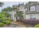 Charming townhouse featuring well-manicured landscaping and neutral exterior paint at 3733 Sidney Lanier Blvd, Duluth, GA 30096