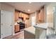 Open kitchen features wooden cabinets, stainless steel oven and cooktop, and luxury vinyl plank flooring at 3733 Sidney Lanier Blvd, Duluth, GA 30096
