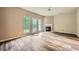 Open living room featuring a fireplace, hardwood floors, and lots of light at 3733 Sidney Lanier Blvd, Duluth, GA 30096