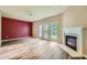 Living room featuring hardwood floors, fireplace, and natural light at 3733 Sidney Lanier Blvd, Duluth, GA 30096