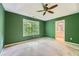 Main bedroom featuring a tray ceiling, ceiling fan, carpet flooring, and an ensuite bathroom at 3733 Sidney Lanier Blvd, Duluth, GA 30096